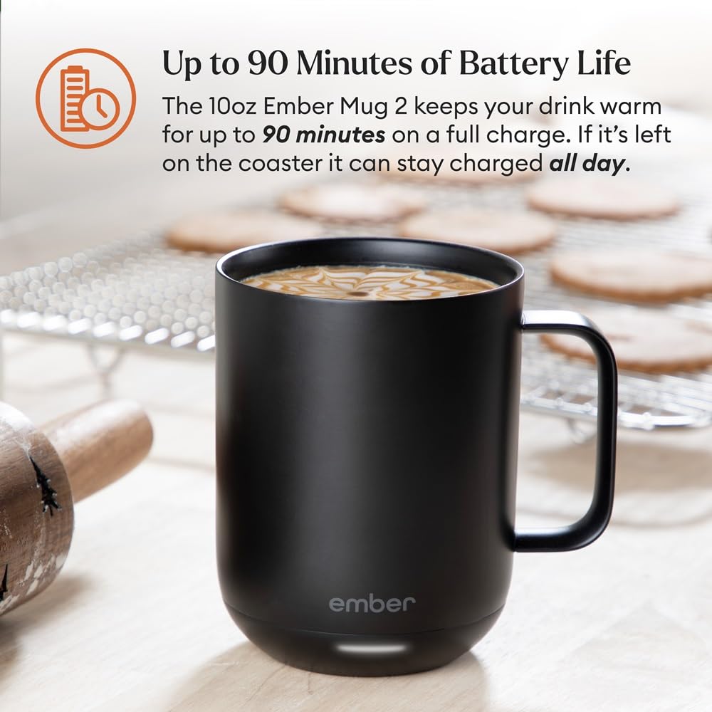  A matte black Ember Smart Mug 2 with a glowing white LED indicator at the base, sitting on a neutral grey surface. Features the Bold Leadership Path logo.