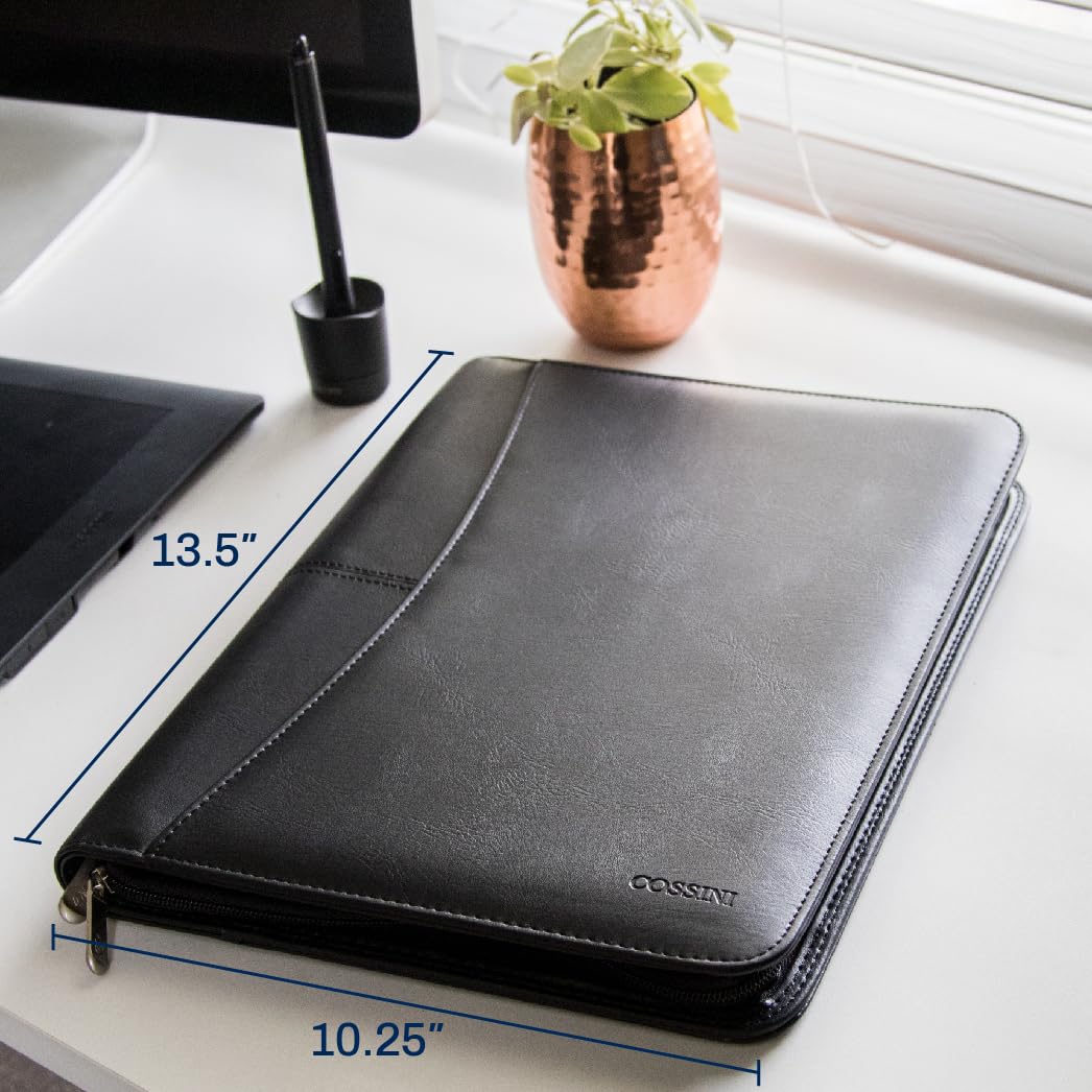  A professional black vegan leather Cossini business portfolio zipped shut, paired with a smartphone and a silver pen on a sleek dark surface. Features the Bold Leadership Path logo