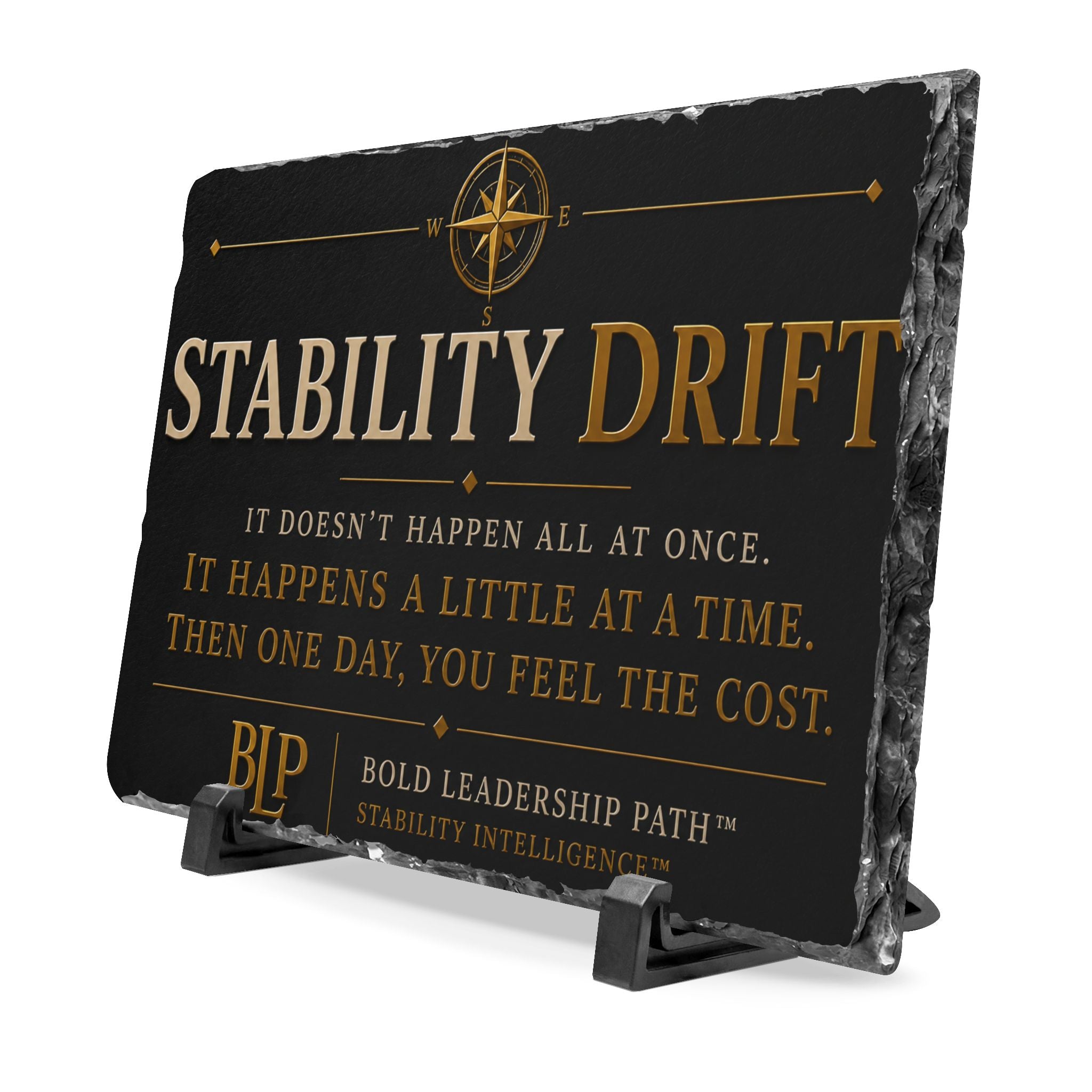Slate with 'Stability Drift' text and compass design on a stand